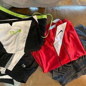 Nike athletic shorts.  Size medium. 4 pairs